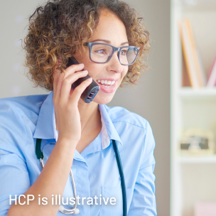 A female HCP performing a consultation by phone